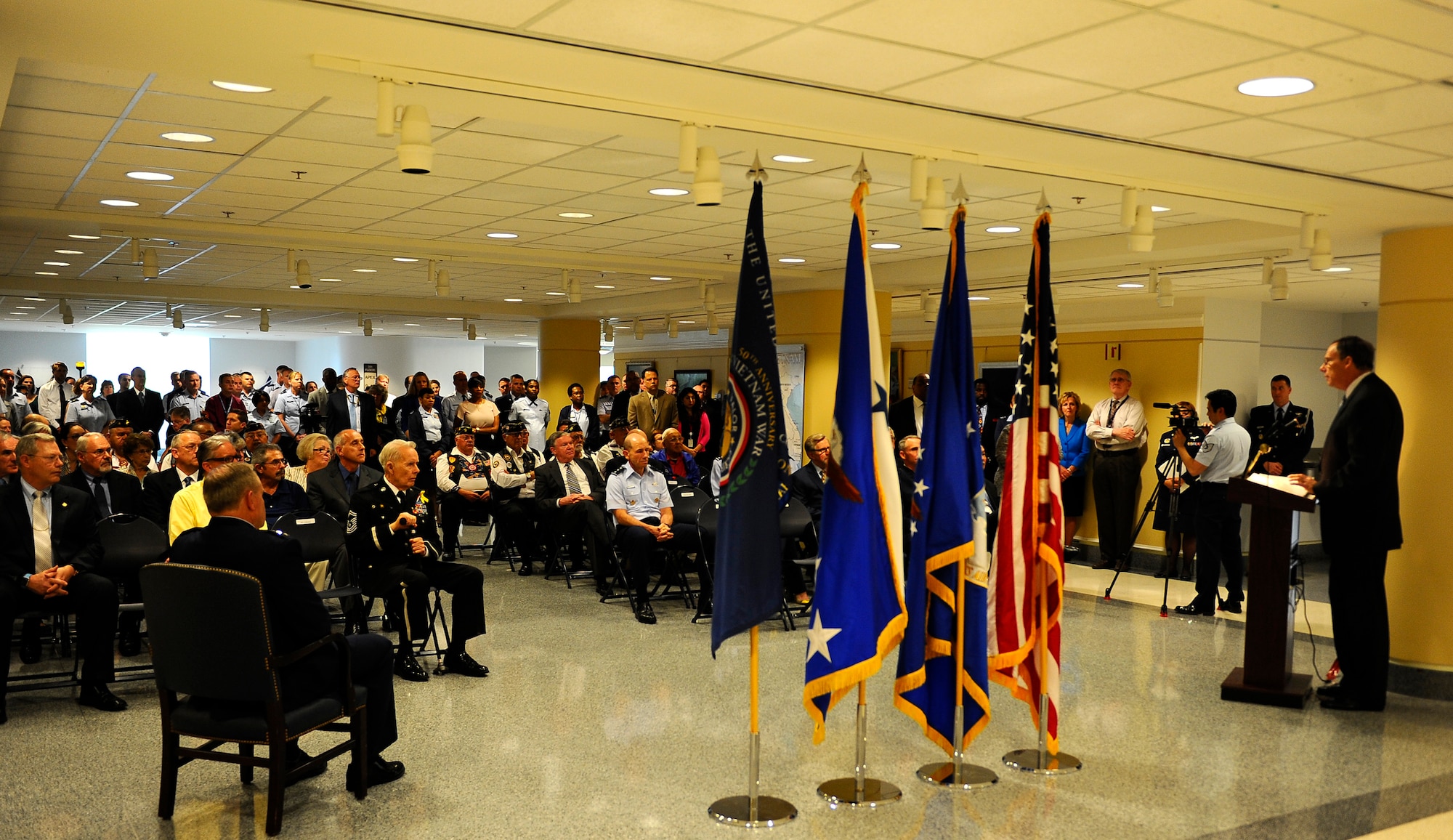 Vietnam veterans and guests attend the opening of the 50th commemoration of the Vietnam War art display in the Air Force Art Gallery located in the Pentagon, Washington, D.C., May 26, 2016. (U.S. Air Force photo/Staff Sgt. Carlin Leslie)