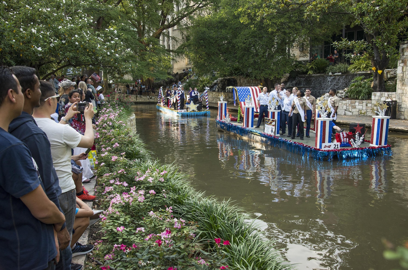 The 2016 Fiesta Ambassadors float by during the Armed Forces River Parade May 21 at the San Antonio Riverwalk. Two ambassadors from the Army, Air Force, Navy, Marines Corps and Coast Guard are selected to represent U.S. forces in San Antonio during April’s Fiesta and at other community functions throughout the year.