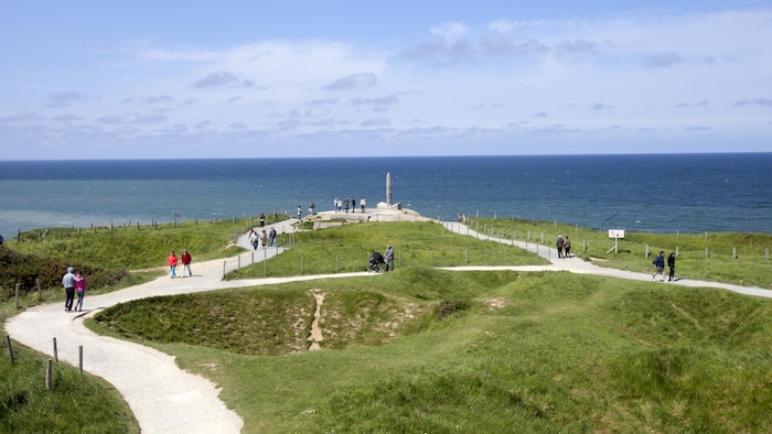 Tourists and Marines from Headquarters and Service Battalion, Headquarters Marine Corps, Henderson Hall and Marine Barracks Washington, D.C. explore the battle grounds at Point du Hoc, France along the coast of Omaha Beach, May 25, 2016. More than 70 Marines took part in a five-day, professional military education trip to France to learn about U.S. military history. 