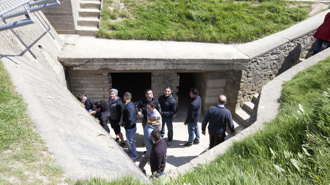 Marines from Headquarters and Service Battalion, Headquarters Marine Corps, Henderson Hall and Marine Barracks Washington, D.C. explore a German bunker and fortification on the coast of Omaha Beach at Point du Hoc, France, May 25, 2016. More than 70 Marines participated in a five-day professional military educational trip to learn about U.S. military history. 