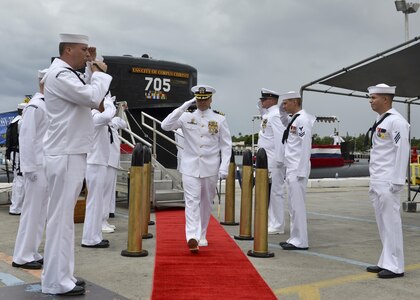 160530-N-LY160-530 JOINT BASE PEARL HARBOR-HICKAM, Hawaii (May 30, 2016) Commander Travis M. Petzoldt, commanding officer of the Los Angeles-class fast-attack submarine USS City of Corpus Christi (SSN 705), is piped ashore at the conclusion of a Memorial Day decommissioning ceremony at Joint Base Pearl Harbor-Hickam. City of Corpus Christi concluded 33 years of service as the second U.S. warship to be named after Corpus Christi, Texas. (U.S. Navy photo by Mass Communication Specialist 2nd Class Michael H. Lee)