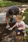 U.S. Marine Lance Cpl. Adrian Lozano helps an Australian preschooler plant seeds at Millner Preschool, Northern Territory, Australia, on May 28, 2016. U.S. Marines with Forward Coordination Element, Marine Rotational Force – Darwin, volunteered with preschool teachers and parents to clean up the schoolyard for preschoolers. MRF-D is a six-month deployment of Marines into Darwin, Australia, where they will contribute to and engage with local communities. Lozano, from Los Angeles, California, is an administration specialist with FCE, MRF-D.