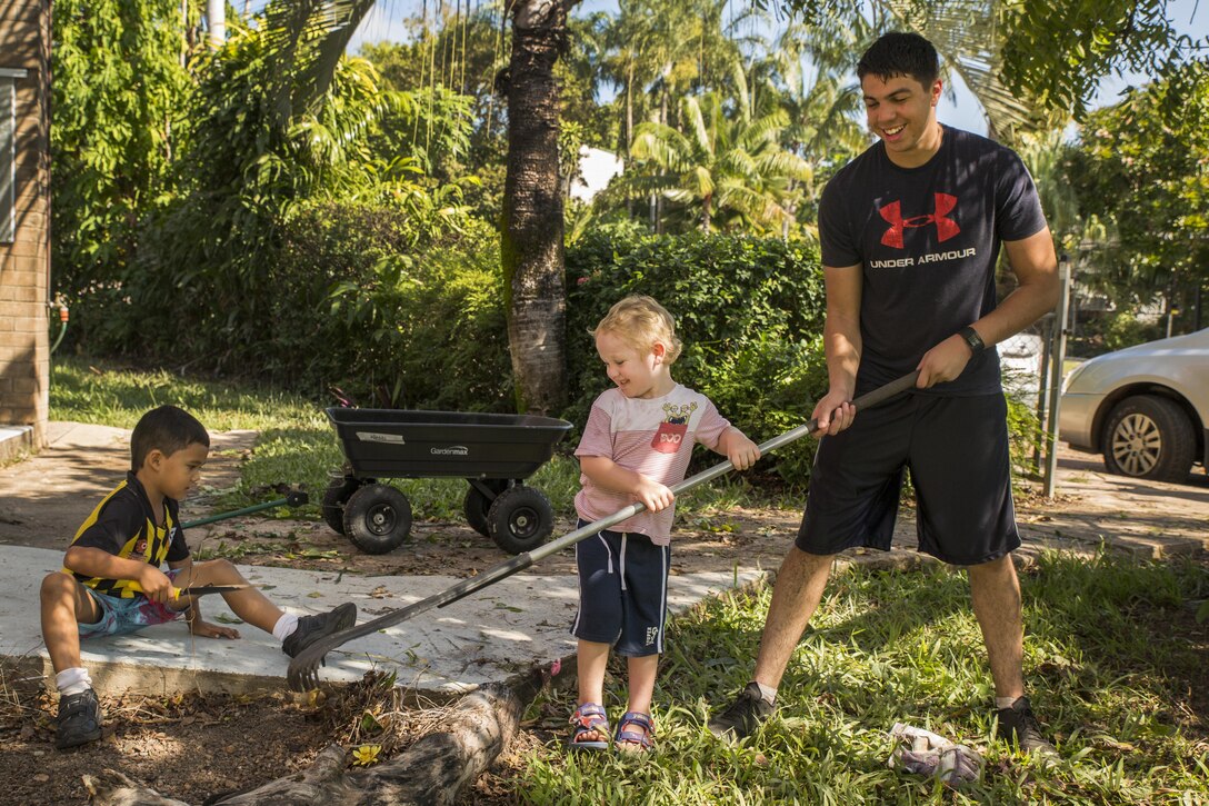 U.S. Marine Lance Cpl. Simon Delacruz helps an Australian preschooler rake a garden at Millner Preschool, Northern Territory, Australia, on May 28, 2016. U.S. Marines with Forward Coordination Element, Marine Rotational Force – Darwin, volunteered with preschool teachers and parents to clean up the schoolyard for preschoolers. MRF-D is a six-month deployment of Marines into Darwin, Australia, where they will contribute to and engage with local communities. Delacruz, from Rochester, New York, is a cyber network operator with FCE, MRF-D.