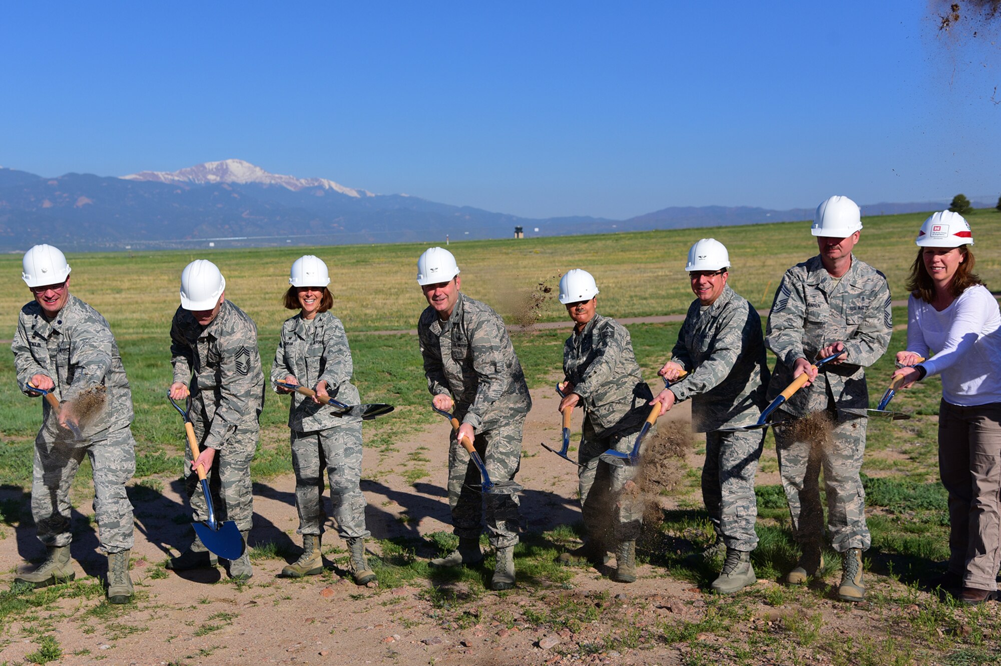 PETERSON AIR FORCE BASE Colo. – Col. Douglas Schiess, 21st Space Wing commander, and Chief Master Sgt. Idalia Peele, 21st Space Wing command chief, assist the 21st Medical Group leadership in breaking ground on where the new dental clinic will be on Peterson Air Force Base, Colo., May 25, 2016. The new clinic is expected to be completed in the fall of 2017. (U.S. Air Force photo by Staff Sgt. Amber Grimm)