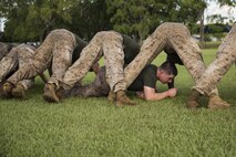 Lance Cpl. Quinlan C. Shannon-Lohenry, a machine gunner, low crawls through Marines and sailors during a squad competition at Robertson Barracks, Northern Territory, Australia, on May 25, 2016. The squad-level competition determined which rifle squad or weapons platoon section had the best physical fitness, small-unit leadership, and cohesion within Company C. Shannon-Lohenry, from Algoma, Wisconsin, is with Company C, 1st Battalion, 1st Marines, Marine Rotational Force - Darwin.