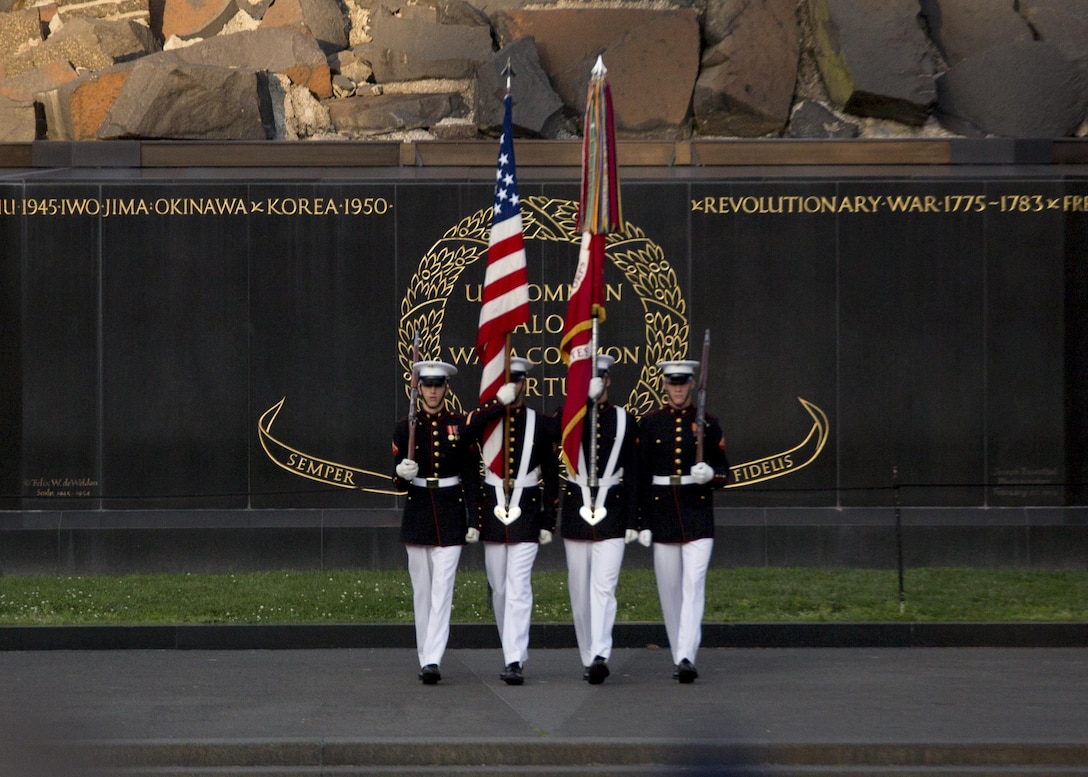 The United States Marine Corps Color Guard, Marine Barracks Washington, D.C., performs during the Sunset Parade at the Marine Corps War Memorial, Arlington, Va., May 31, 2016. The guest of honor for the parade was Rear Adm. Valter Zappellini, Dean of Corps of Foreign Naval Attachés, Italian Navy, and the hosting official was Brigadier Gen. Michael S. Groen, director of Intelligence, J-2. (Official Marine Corps photo by Cpl. Chi Nguyen/Released)