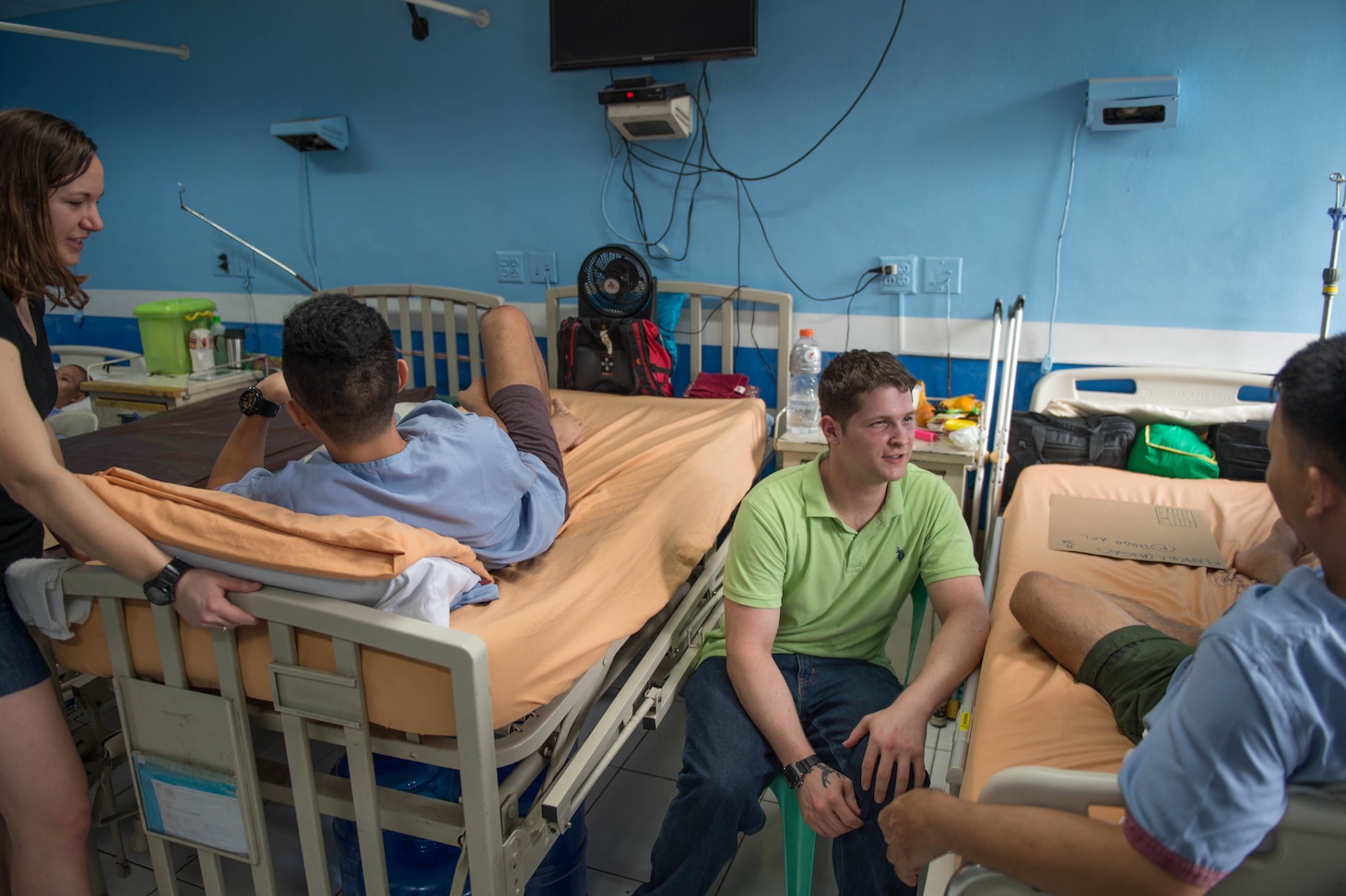 160523-N-KM939-160 QUEZON CITY, Philippines (May 23, 2016) Lt. j.g. Cassandra Mulkey and Hospital Corpsman 2nd Class Jordan Witten, both assigned to USS John C. Stennis (CVN 74), talk with injured Filipino soldiers at the Armed Forces of the Philippines Medical Center during a community service event. John C. Stennis is in the Philippines for a routine port visit but participates in community service programs to learn and work alongside their host-nation counterparts. Providing a ready force supporting security and stability in the Indo-Asia-Pacific, John C. Stennis is operating as part of the Great Green Fleet on a regularly scheduled 7th Fleet deployment. (U.S. Navy photo by Mass Communication Specialist 3rd Class David Cox/Released)