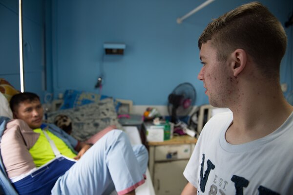160523-N-KM939-175 QUEZON CITY, Philippines (May 23, 2016) Aviation Boatswain's Mate (Handling) Airman Caleb Perryman, assigned to USS John C. Stennis (CVN 74), talks with an injured soldier at the Armed Forces of the Philippines Medical Center during a community service event. John C. Stennis is in the Philippines for a routine port visit but participates in community service programs to learn and work alongside their host-nation counterparts. Providing a ready force supporting security and stability in the Indo-Asia-Pacific, John C. Stennis is operating as part of the Great Green Fleet on a regularly scheduled 7th Fleet deployment. (U.S. Navy photo by Mass Communication Specialist 3rd Class David Cox/Released)