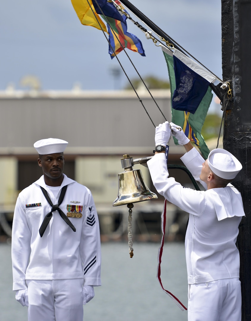 160530-N-LY160-379 JOINT BASE PEARL HARBOR-HICKAM, Hawaii (May 30, 2016) Sailors assigned to Los Angeles-class fast-attack submarine USS City of Corpus Christi (SSN 705) strike the commissioning pennant during a Memorial Day decommissioning ceremony at Joint Base Pearl Harbor-Hickam. City of Corpus Christi concluded 33 years of service as the second U.S. warship to be named after Corpus Christi, Texas. (U.S. Navy photo by Mass Communication Specialist 2nd Class Michael H. Lee)