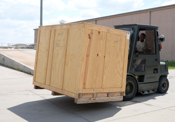 Airman Michael Butler, 28th Logistics Readiness Squadron receiving technician, uses a forklift to retrieve a crate at Ellsworth Air Force Base, S.D., May 17, 2016. The 28th LRS Traffic Management Office can receive shipments anywhere from 200 pounds to 18,000 pounds for one shipment. (U.S. Air Force photo by Airman 1st Class Sadie Colbert/Released)