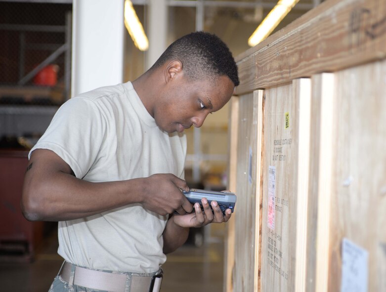 Airman Michael Butler, 28th Logistics Readiness Squadron receiving technician, scans an Air Force form 1348 on a crate into the inventory system at Ellsworth Air Force Base, S.D., May 17, 2016. The forms are used to verify what items are contained in the box, what they are to be used for or who receives them. (U.S. Air Force photo by Airman 1st Class Sadie Colbert/Released)