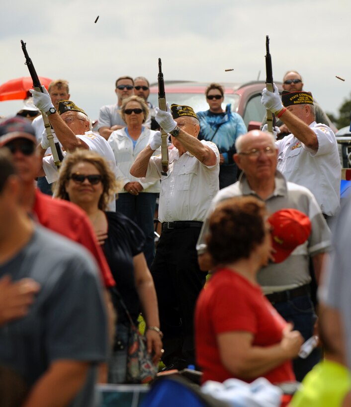 Members of the Veterans of Foreign Wars Post 1273 from Rapid City, S.D., perform a 21 gun salute while taps played during a Memorial Day ceremony at the Black Hills National Cemetery in Sturgis, S.D., May 30, 2016. Today, whenever a man is buried with military honors anywhere in the United States, the ceremony is concluded with the 21 gun salute, and sounding of taps. (U.S. Air Force photo by Airman 1st Class Denise M. Nevins/Released)