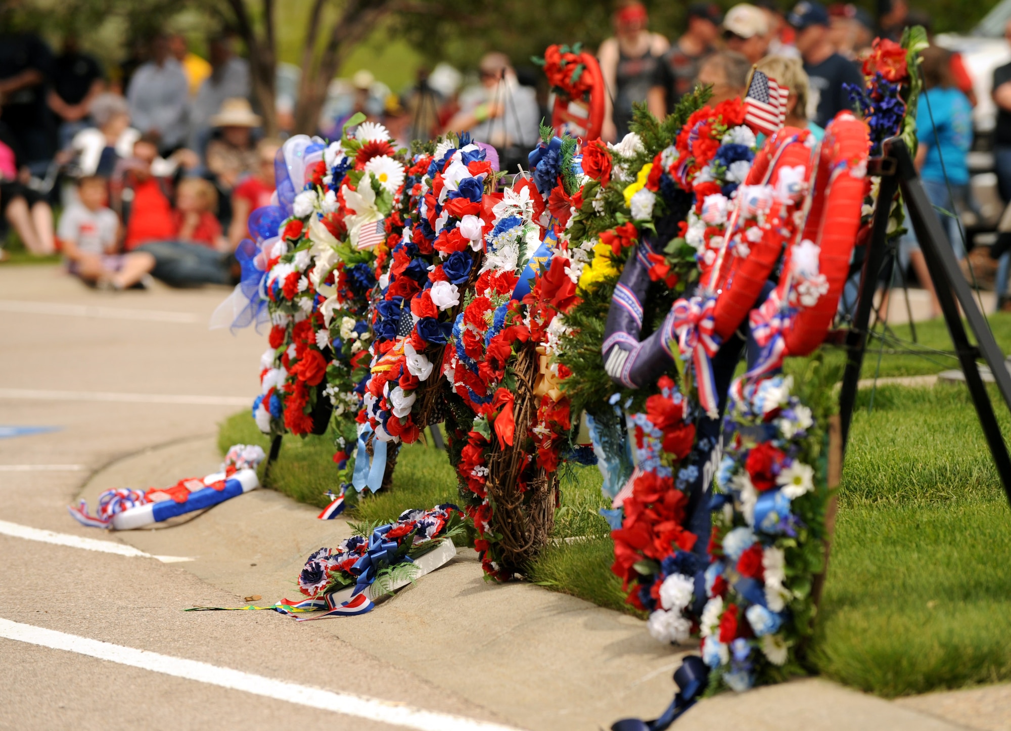 A rack of wreaths sits out on display during a wreath laying ceremony at the Black Hills National Cemetery in Sturgis, S.D., May 30, 2016. The wreath laying ceremony was observed as part of the cemetery’s Memorial Day events. (U.S. Air Force photo by Airman 1st Class Denise M. Nevins/Released)