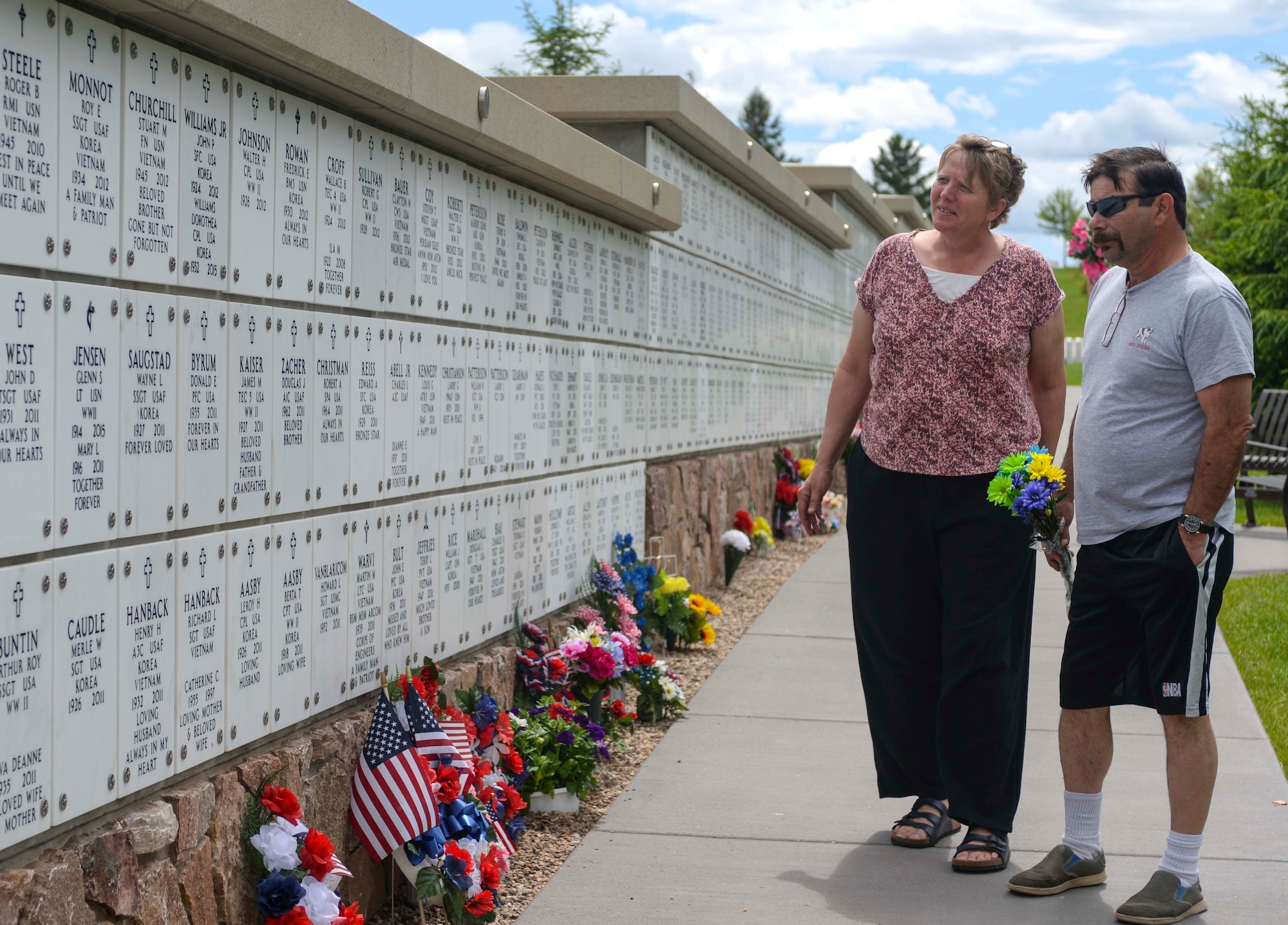 Yvone, left, and Galen Tapio, locals of Rapid City, S.D., search for their relative’s grave at the Black Hills National Cemetery in Sturgis, S.D., May 28, 2016. Family members visit the cemetery throughout the year to mourn for their service members who have passed. To contact the cemetery, call (800) 535-1117. (U.S. Air Force photo by Airman 1st Class Sadie Colbert/Released)