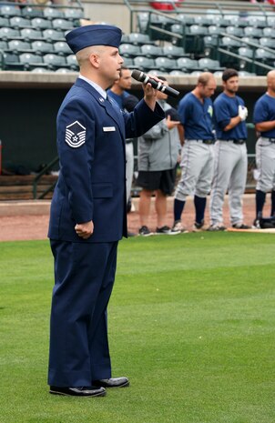Master Sgt. Jason Gilbert, a 628th Medical Operations Squadron superintendent, sings the national anthem during Military Appreciation Night, May 19, 2016 at Joseph P. Riley Jr. ballpark in Charleston, S.C. The Charleston RiverDogs hosted Military Appreciation Night to show their support for the local military. (U.S. Air Force photo/ Airman 1st Class Haleigh Laverty)