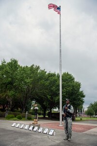 A 628th Security Forces Airman guards a memorial honoring fallen security service members during Police Week at Joint Base Charleston, S.C. May 18, 2016. A 24-hour silent vigil was held for nine law enforcement Airmen who made the ultimate sacrifice. (U.S. Air Force photo/Staff Sgt. Jared Trimarchi) 