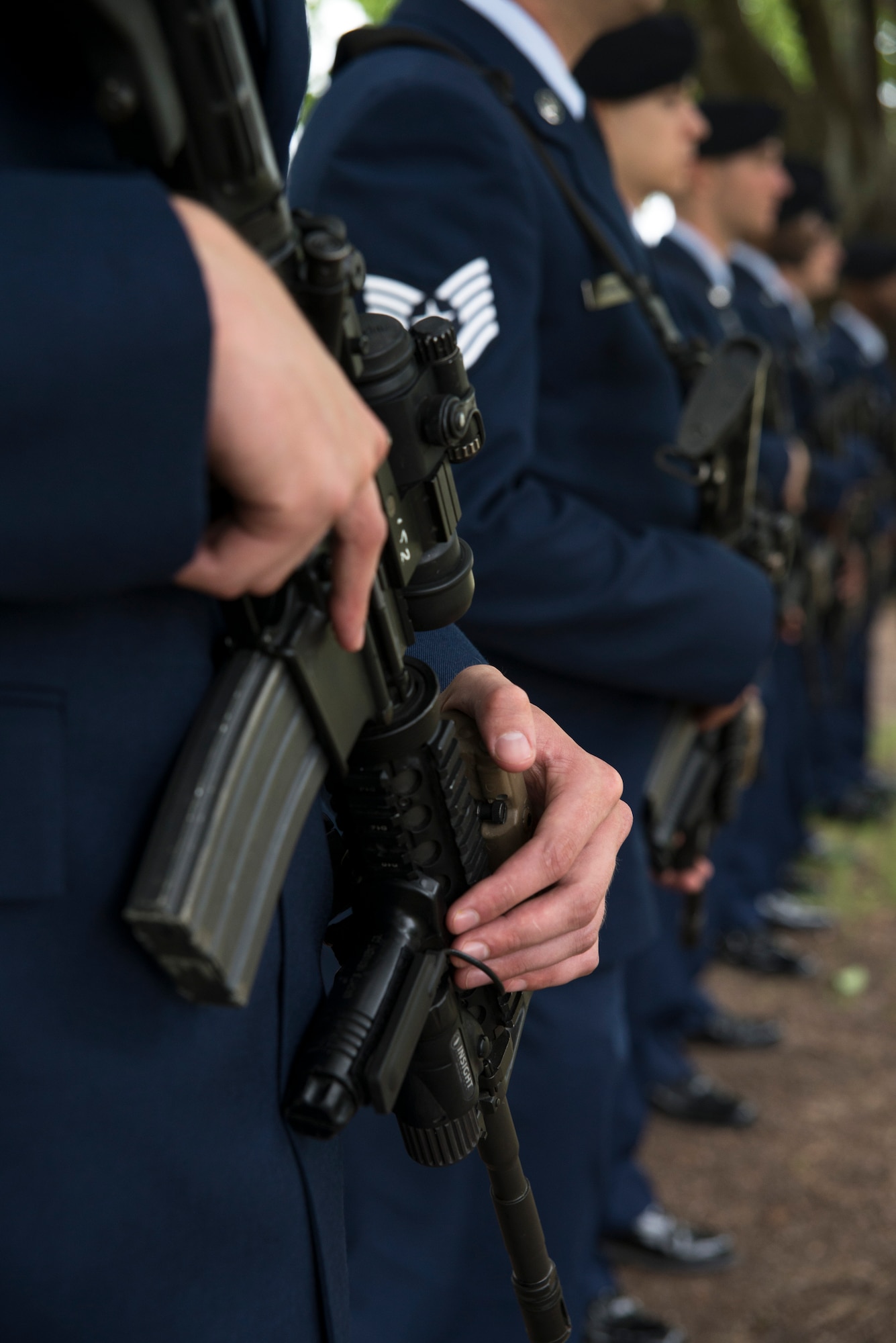 Airman from the 628th Security Forces Squadron prepare to present a three-volley salute to honor the fallen men and women in law enforcement during the National Police Week ceremony May 20, 2016, at the base flag pole on Joint Base Charleston – Air Base, S.C.   In honor of Police Week, the 628th SFS collaborated with multiple base agencies to conduct various events to remember and celebrate their deceased brothers and sisters in law enforcement. (U.S. Air Force Photo/Airman 1st Class Haleigh Laverty)