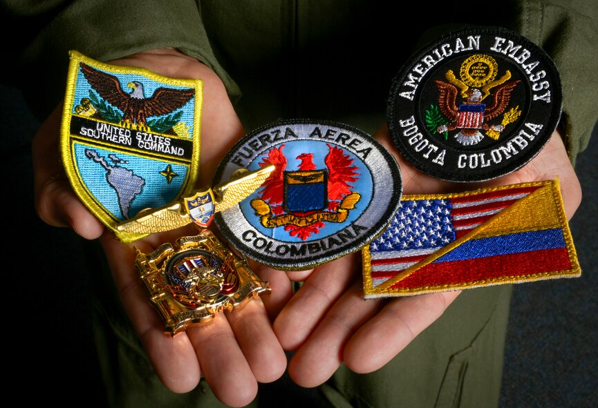 Capt. Julio “Baxter” Arizmendi, 23rd Bomb Squadron pilot, holds memorabilia at Minot Air Force Base, N.D.,  Jan. 26, 2016. Arizmendi received these gifts along with others during a trip he took to Colombia during a Language Intensive Training Event where he used his bi-lingual capabilities to translate messages between U.S. and Colombian armed forces. (U.S. Air Force photo/Senior Airman Sahara L. Fales)