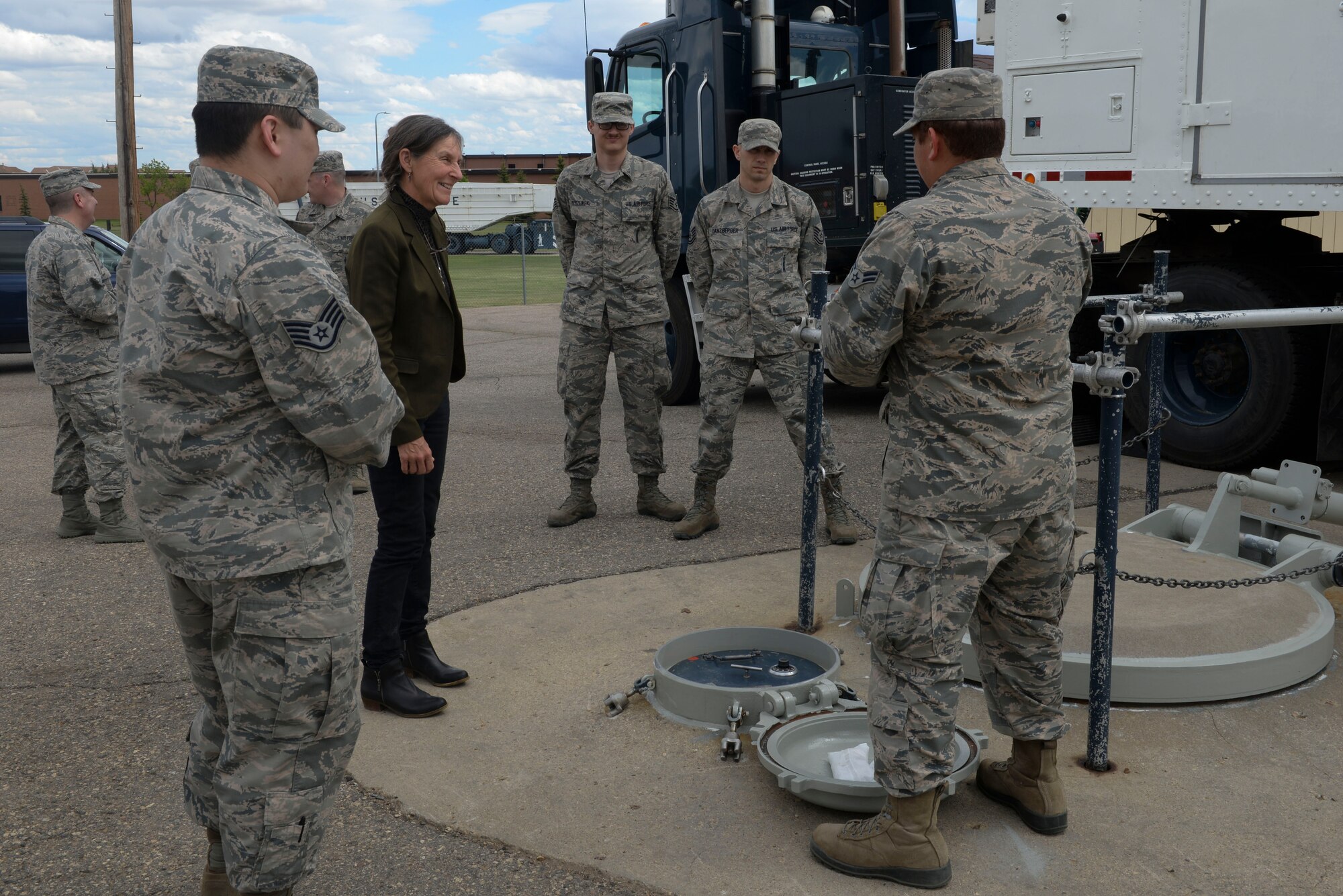 Retired Brig. Gen. Rhonda Cornum, a former U.S. Army flight surgeon, visits with Airmen from the 791st Maintenance Squadron at Minot Air Force Base, N.D., May 24, 2016. During her visit, Cornum visited with 91st Missile Wing and 5th Bomb Wing Airmen to give a speech on comprehensive fitness and her experience as a prisoner of war during the Persian Gulf War. (U.S. Air Force Photo/Airman 1st Class Jessica Weissman)