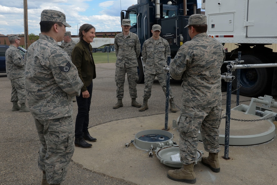 Retired Brig. Gen. Rhonda Cornum, a former U.S. Army flight surgeon, visits with Airmen from the 791st Maintenance Squadron at Minot Air Force Base, N.D., May 24, 2016. During her visit, Cornum visited with 91st Missile Wing and 5th Bomb Wing Airmen to give a speech on comprehensive fitness and her experience as a prisoner of war during the Persian Gulf War. (U.S. Air Force Photo/Airman 1st Class Jessica Weissman)