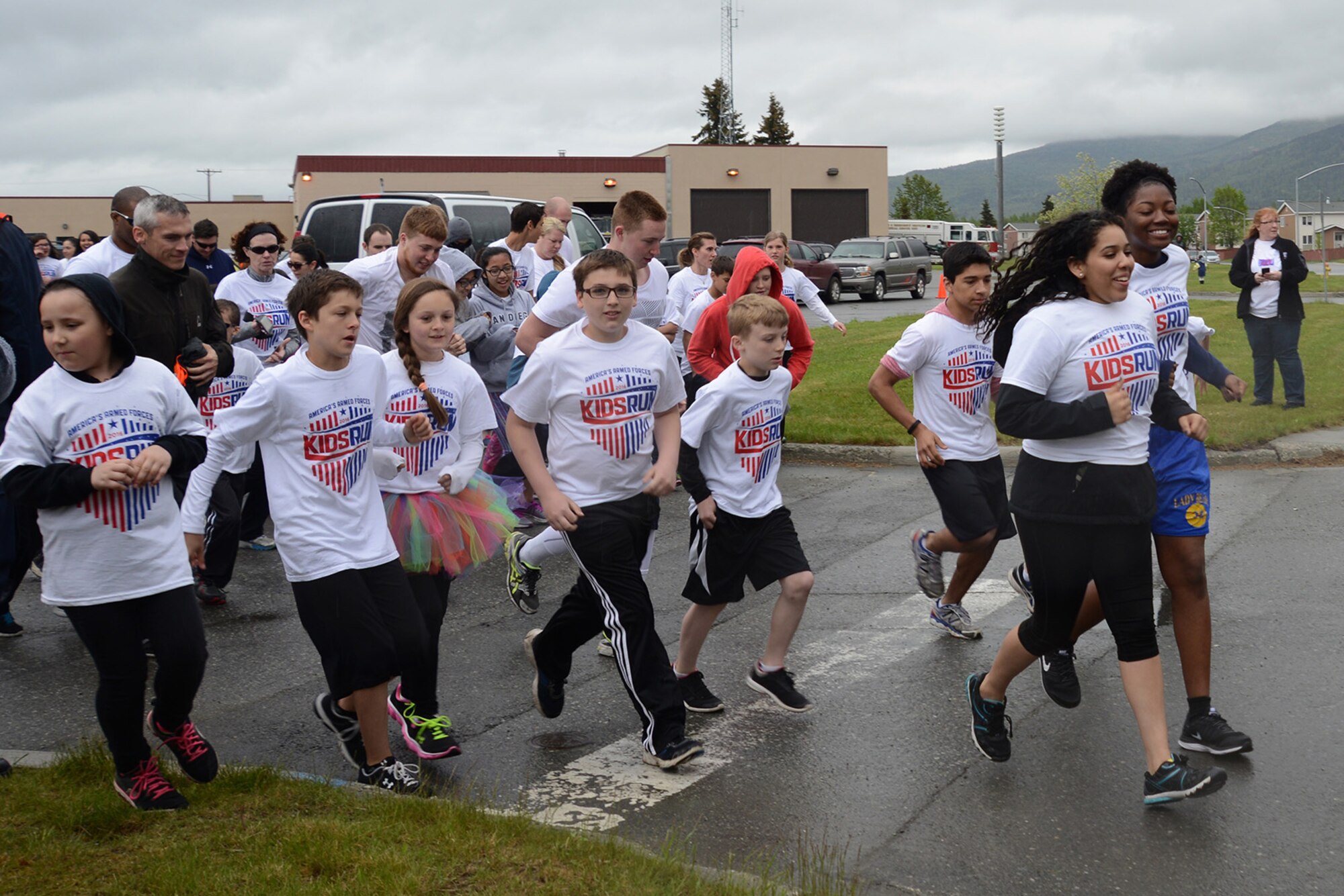 Participants start America’s Armed Forces Color Run at Joint Base Elmendorf-Richardson, Alaska, May 21, 2016. The Alaska Military Youth Academy, JBER Life, USO, and volunteers provided water, food, photo opportunities, and dye at multiple stations along the run. (U.S. Air Force photo by Airman 1st Class Christopher R. Morales)