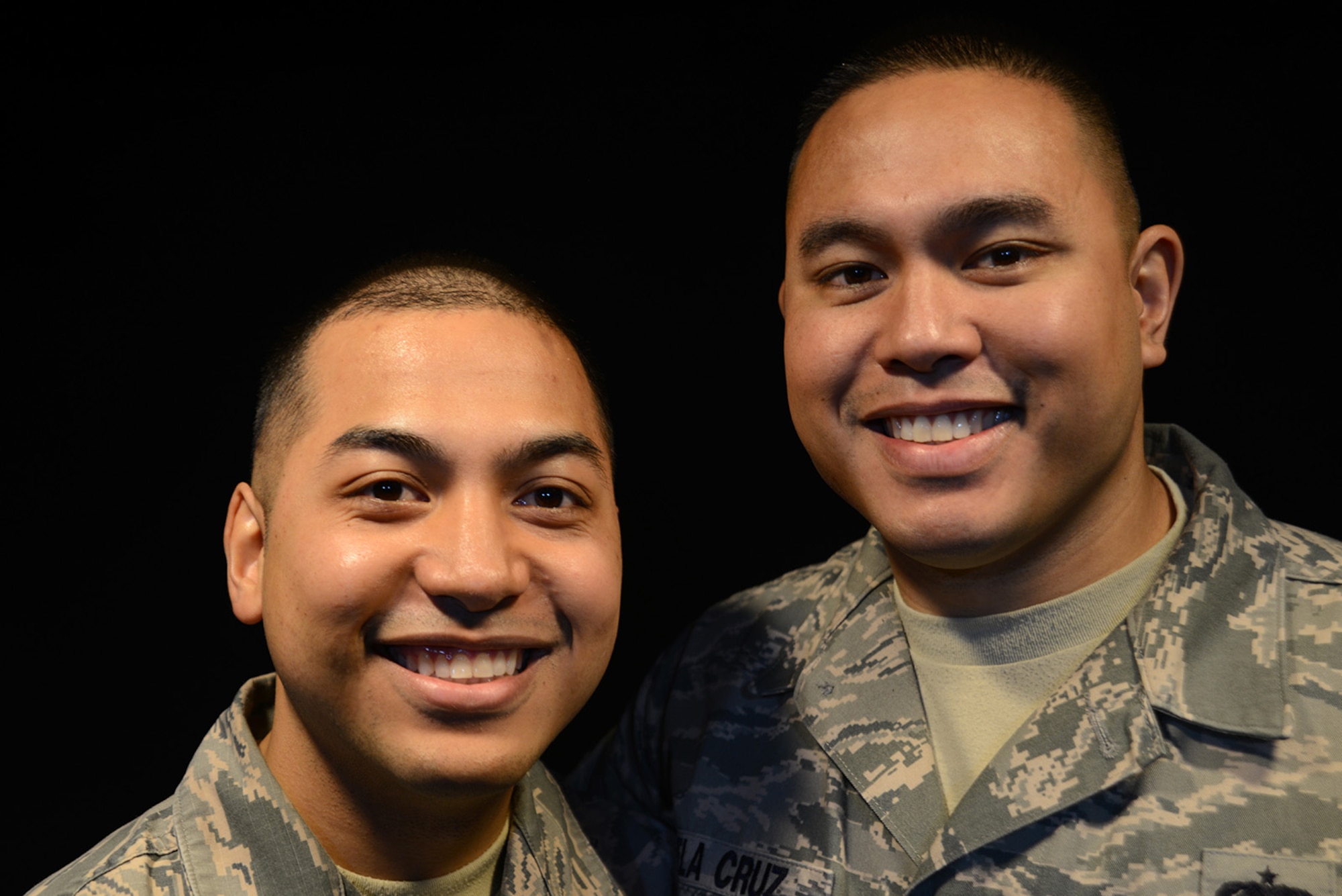 Air Force Staff Sgt. Michael Camacho (left), 3rd Maintenance Group executive services manager, and Tech. Sgt. Daniel Dela Cruz (right), 703rd Aircraft Maintenance Squadron, 962nd Aircraft Maintenance Unit element lead, are close friends and consider each other family since they met during their last assignment in Japan. They grew up on opposite sides of the island of Guam, despite their differences they share more similarities being proud Chamorro and military members. (U.S. Air Force photo by Airman 1st Class Christopher R. Morales)