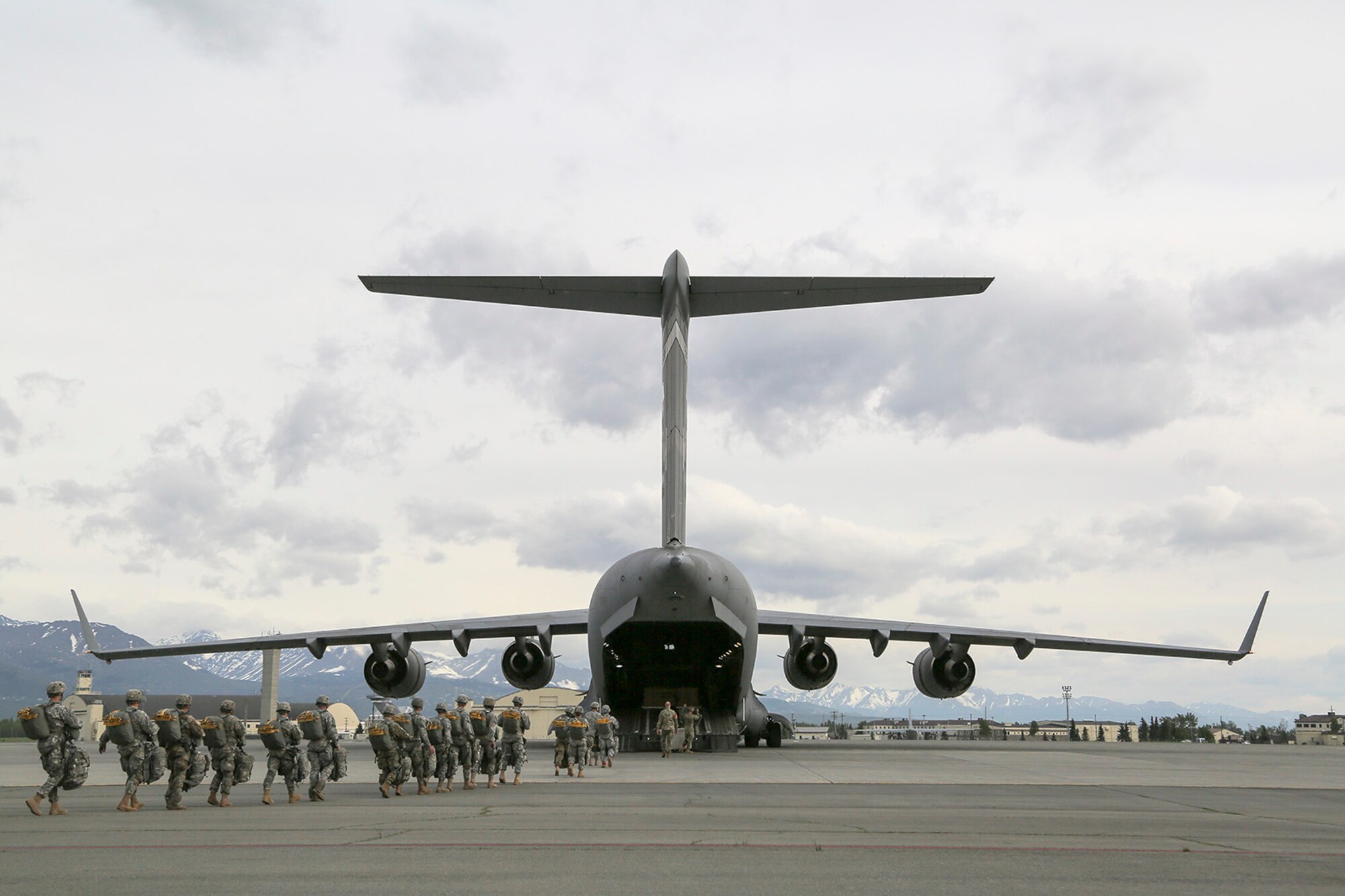 U.S. Army paratroopers assigned to the 1st Battalion, 501st Parachute Infantry Regiment, 4th Infantry Brigade Combat Team (Airborne), 25th Infantry Division, board a U.S. Air Force C-17 Globemaster III, assigned to the 517th Airlift Squadron, while conducting joint airborne and air transportability training (JAATT) at Joint Base Elmendorf-Richardson, Alaska, May 19, 2016. JAATT familiarizes units with establishing drop zones and airfields, as well as proper communication with aircraft supporting resupply missions. The Soldiers of 4/25 IBCT belong to the only American airborne brigade in the Pacific and are trained to execute airborne maneuvers in extreme cold weather/high altitude environments in support of combat, partnership and disaster relief operations. (U.S. Air Force photo by Alejandro Pena)