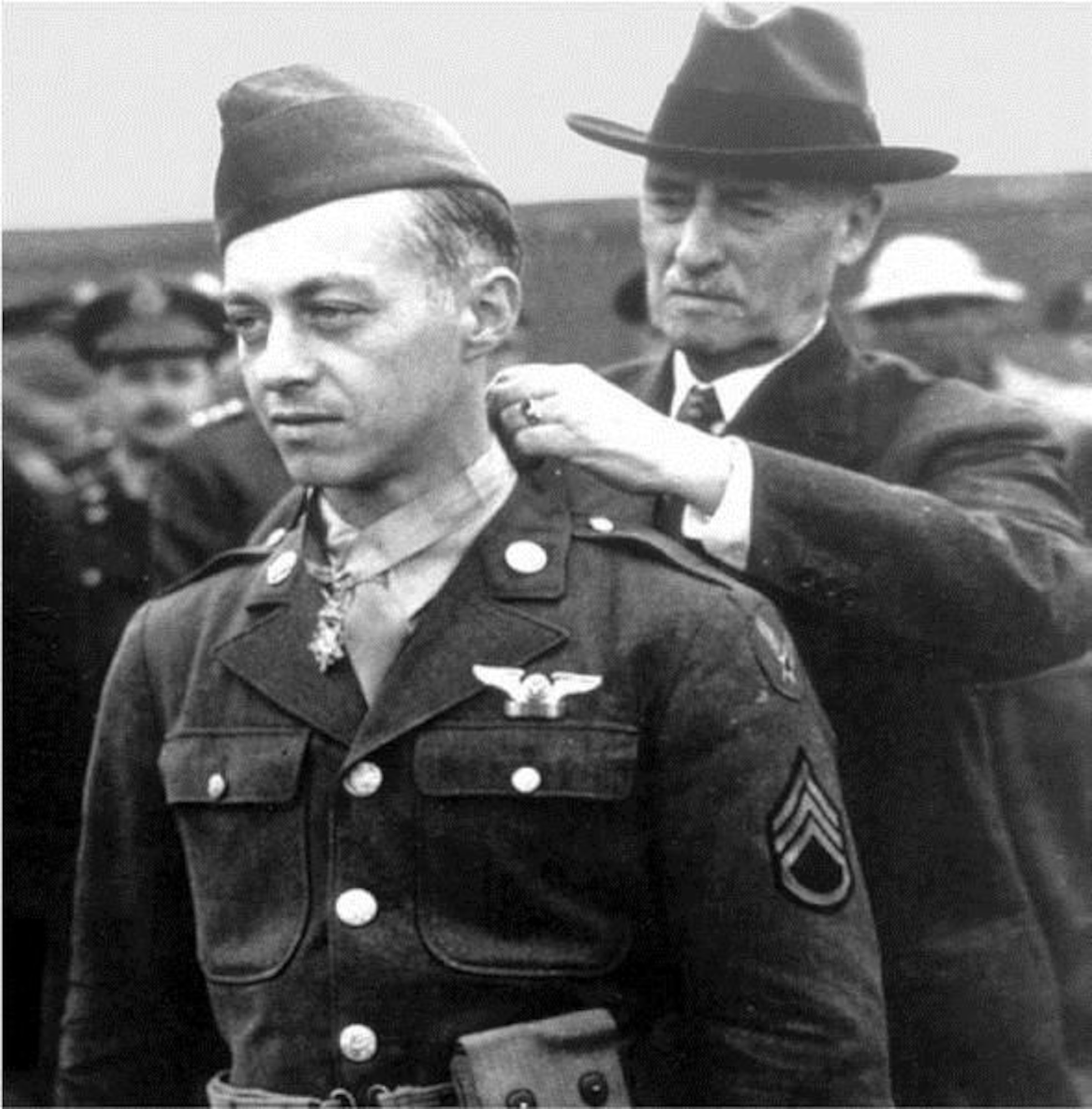 Staff Sgt. Maynard H. Smith receives his Medal of Honor from
Secretary of War Henry L. Stimson July 12, 1943. (Air Force Photo)