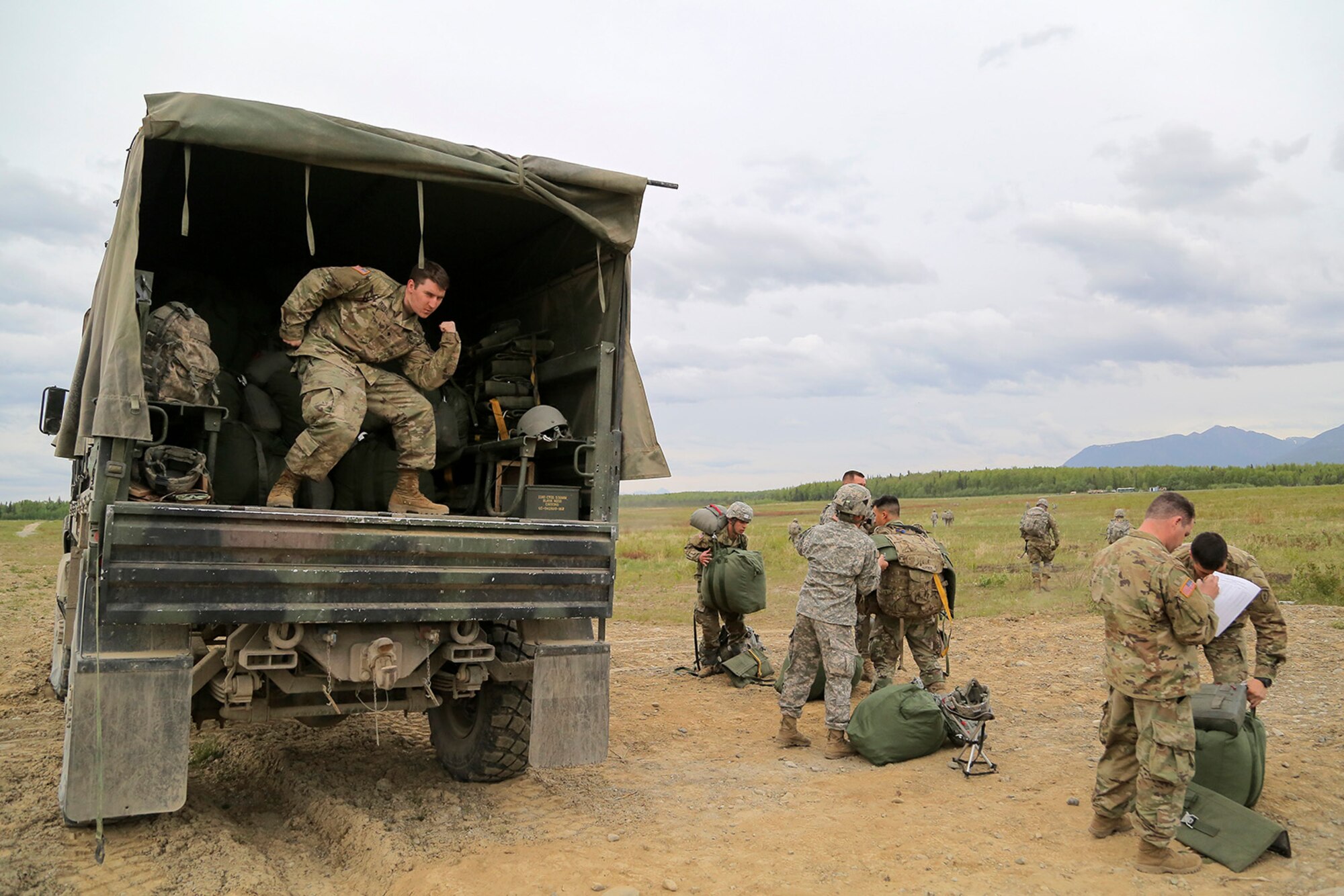 U.S. Army paratroopers assigned to the 1st Battalion, 501st Parachute Infantry Regiment, 4th Infantry Brigade Combat Team (Airborne), 25th Infantry Division, conduct joint airborne and air transportability training (JAATT) at Joint Base Elmendorf-Richardson, Alaska, May 19, 2016. JAATT familiarizes units with establishing drop zones and airfields, as well as proper communication with aircraft supporting resupply missions. The Soldiers of 4/25 IBCT belong to the only American airborne brigade in the Pacific and are trained to execute airborne maneuvers in extreme cold weather/high altitude environments in support of combat, partnership and disaster relief operations. (U.S. Air Force photo by Alejandro Peña)