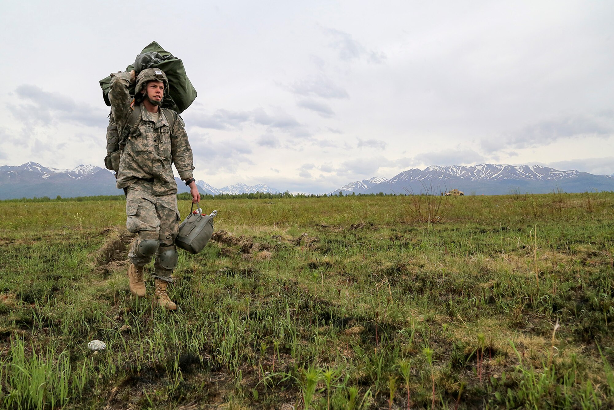 U.S. Army Spc. Josiah Crabtree, assigned to the 1st Battalion, 501st Parachute Infantry Regiment, 4th Infantry Brigade Combat Team (Airborne), 25th Infantry Division, proceeds to the rally point during joint airborne and air transportability training (JAATT) at Joint Base Elmendorf-Richardson, Alaska, May 19, 2016. JAATT familiarizes units with establishing drop zones and airfields, as well as proper communication with aircraft supporting resupply missions. The Soldiers of 4/25 IBCT belong to the only American airborne brigade in the Pacific and are trained to execute airborne maneuvers in extreme cold weather/high altitude environments in support of combat, partnership and disaster relief operations. (U.S. Air Force photo by Alejandro Pena)