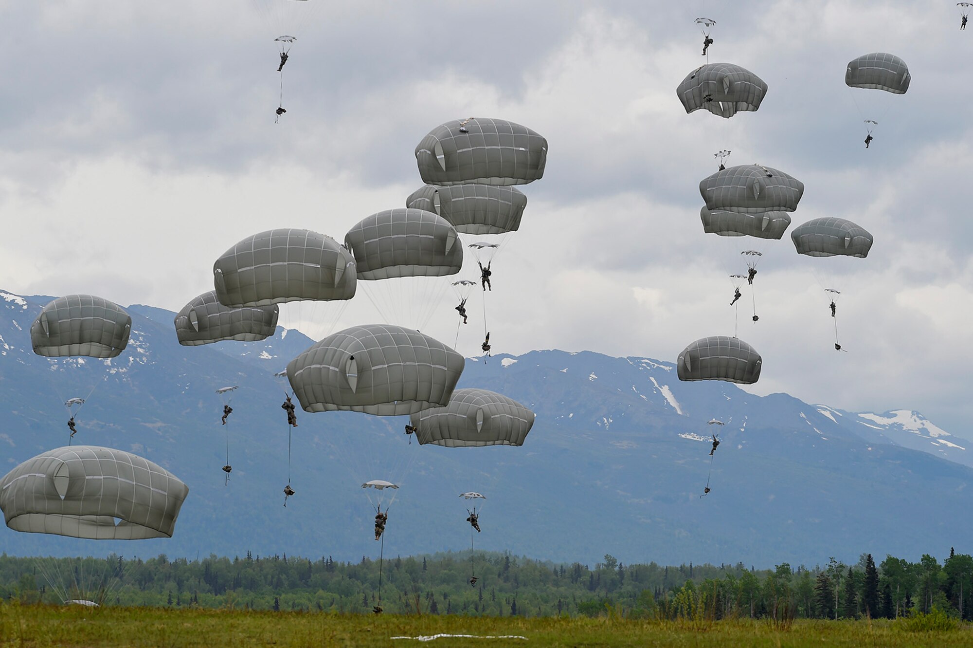 U.S. Army paratroopers assigned to the 1st Battalion, 501st Parachute Infantry Regiment, 4th Infantry Brigade Combat Team (Airborne), 25th Infantry Division, conduct joint airborne and air transportability training (JAATT) at Joint Base Elmendorf-Richardson, Alaska, May 19, 2016. JAATT familiarizes units with establishing drop zones and airfields, as well as proper communication with aircraft supporting resupply missions. The Soldiers of 4/25 IBCT belong to the only American airborne brigade in the Pacific and are trained to execute airborne maneuvers in extreme cold weather/high altitude environments in support of combat, partnership and disaster relief operations. (U.S. Air Force photo by Alejandro Peña)