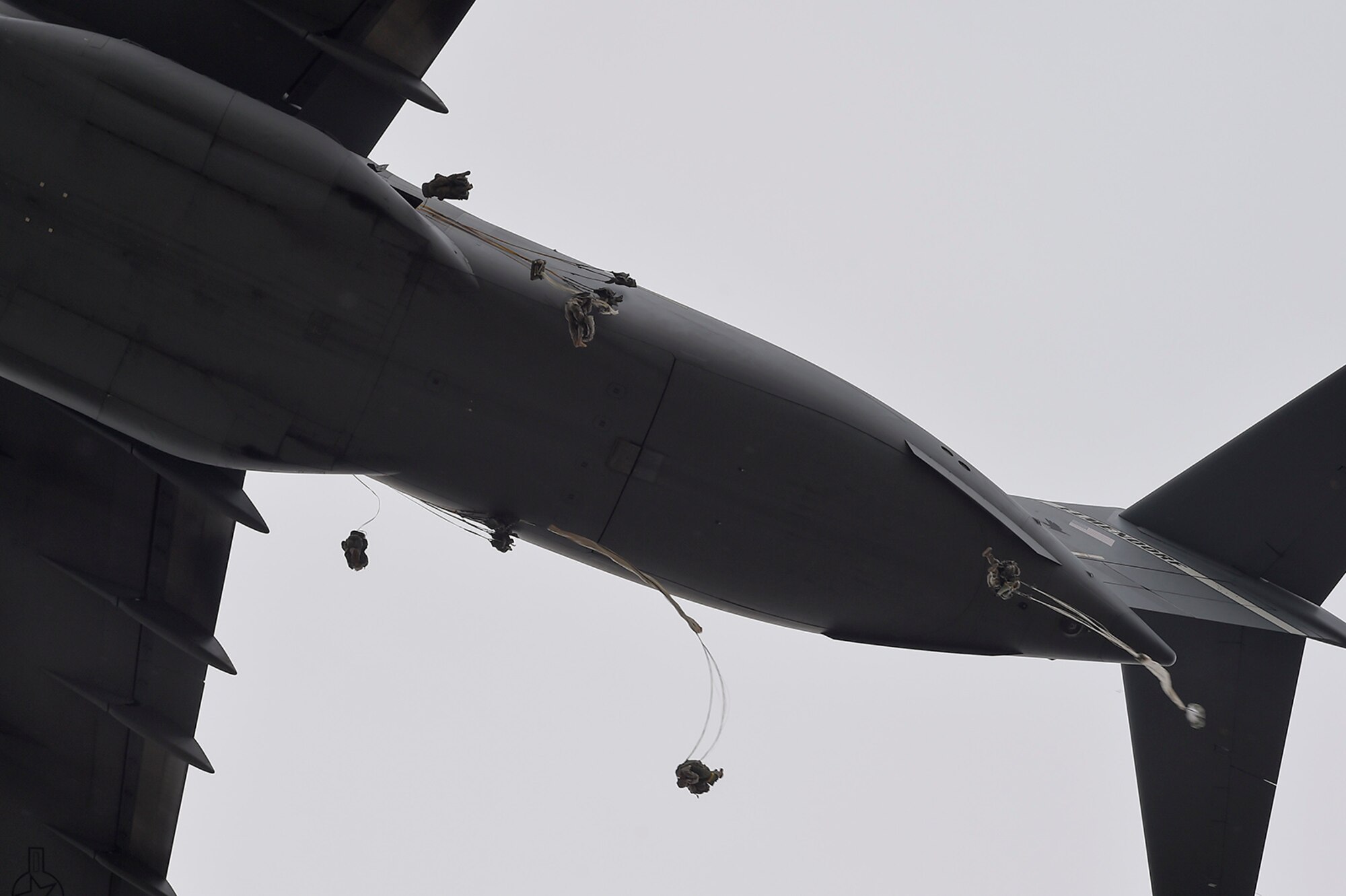U.S. Army paratroopers assigned to the 1st Battalion, 501st Parachute Infantry Regiment, 4th Infantry Brigade Combat Team (Airborne), 25th Infantry Division, jump from a U.S. Air Force C-17 Globemaster III, assigned to the 517th Airlift Squadron, during joint airborne and air transportability training (JAATT) at Joint Base Elmendorf-Richardson, Alaska, May 19, 2016. JAATT familiarizes units with establishing drop zones and airfields, as well as proper communication with aircraft supporting resupply missions. The Soldiers of 4/25 IBCT belong to the only American airborne brigade in the Pacific and are trained to execute airborne maneuvers in extreme cold weather/high altitude environments in support of combat, partnership and disaster relief operations. (U.S. Air Force photo by Alejandro Pena)