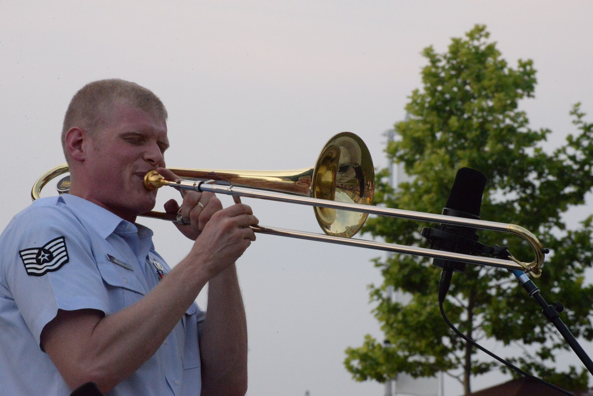 Airmen of Note trombonist Technical Sgt. Kevin Cerovich performs a solo during the U.S. Air Force Band’s summer concert series kick off at National Harbor, Md. May 27, 2016. Through their performances the Airmen of Note and other Air Force bands help build, maintain and strengthen morale, while building public support and awareness of the Air Force and improving relations with communities both locally and globally. (U.S. Air Force photo/Courtesy)