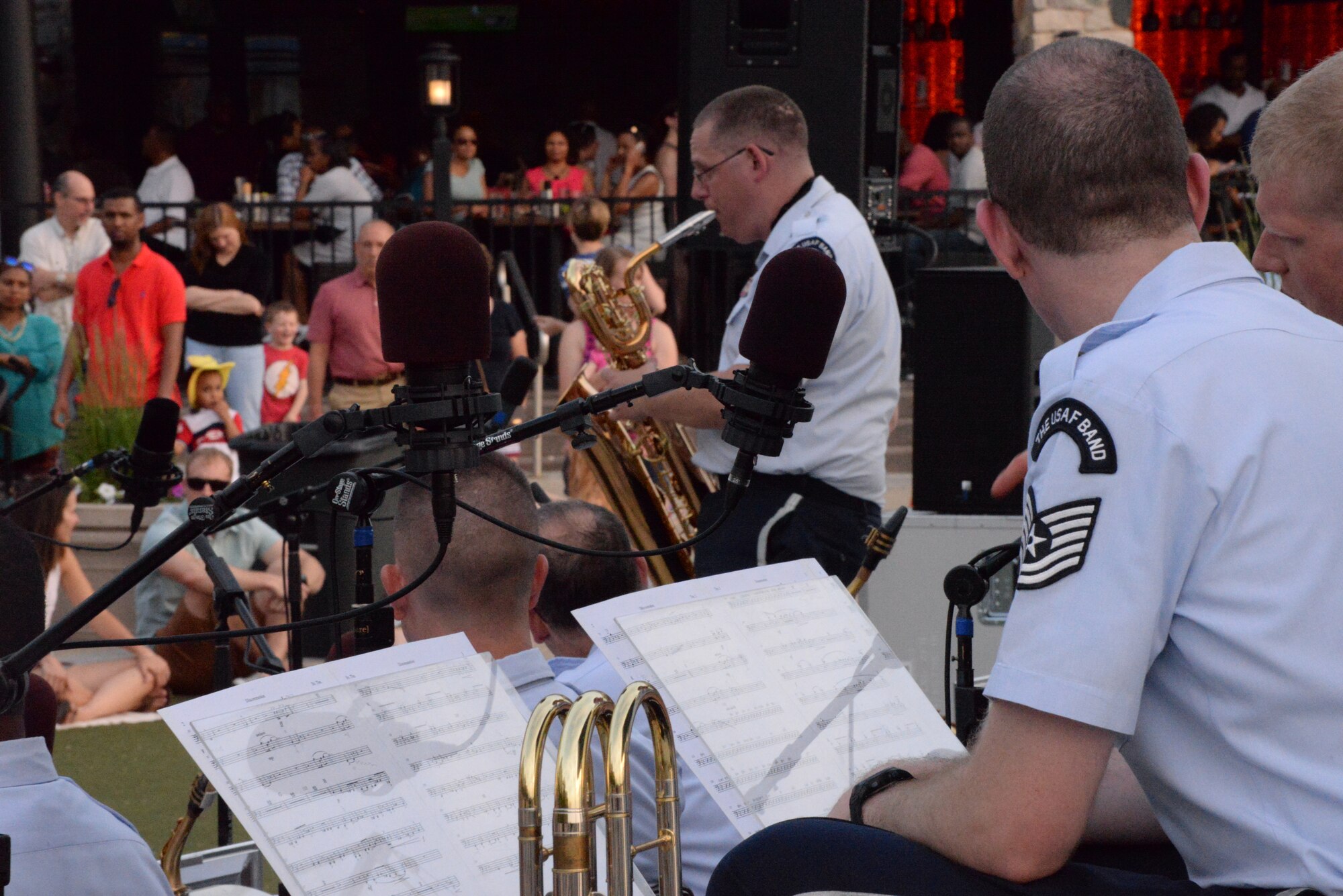 Airmen from the Airmen of Note prepare to perform during the U.S. Air Force Band’s summer concert series kick off at National Harbor, Md. May 27, 2016. This summer marks the 75th birthday of the United States Air Force Band. The Airmen of Note's Summer Concert Series provides a wonderful opportunity for the public to experience the Air Force's high level of professionalism through concerts. (U.S. Air Force photo/Courtesy)