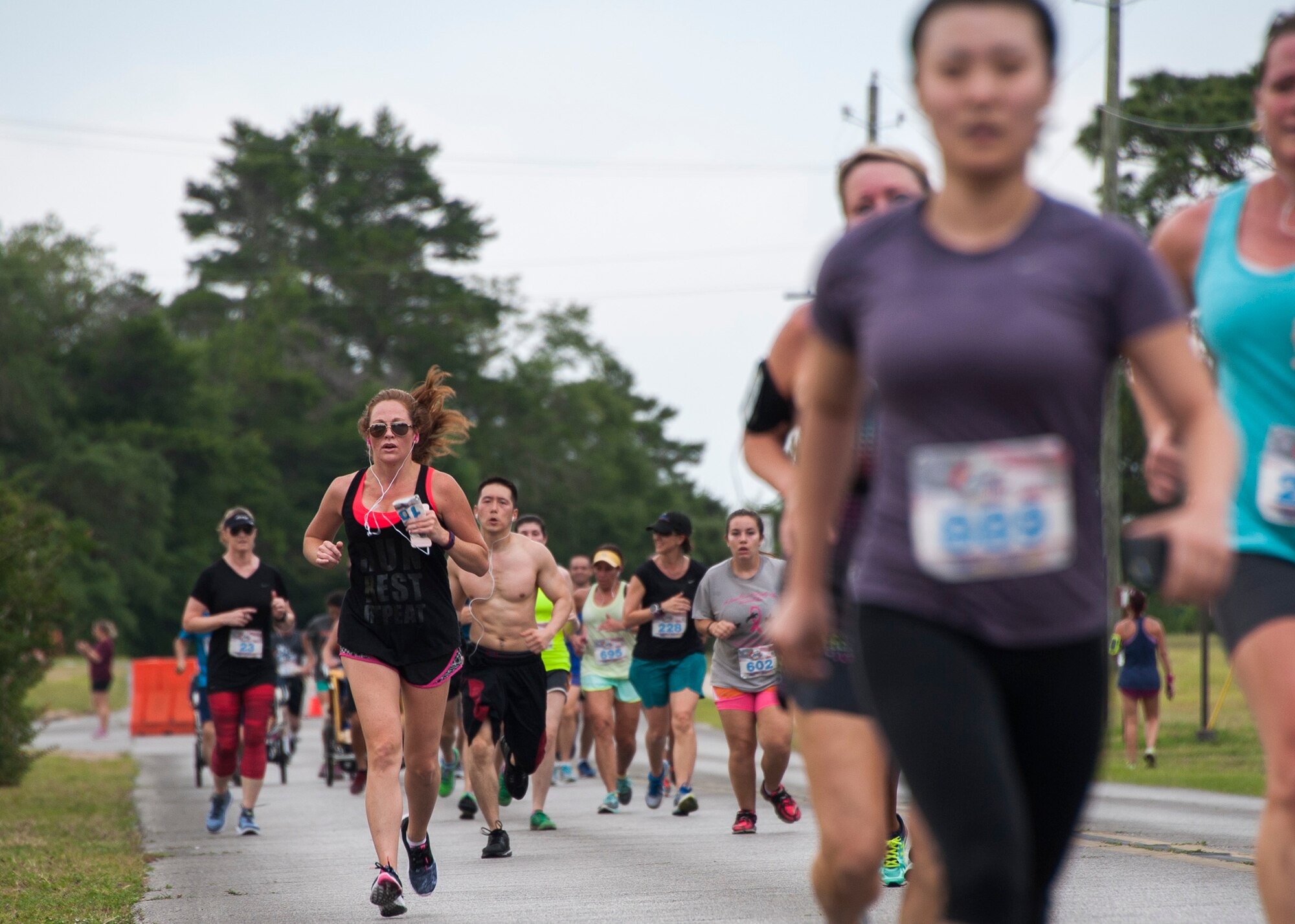 Runners head toward the finish line during the 31st annual Gate to Gate Run May 28 at Eglin Air Force Base, Fla. More than 1,050 runners and walkers partook in the Memorial Day Race and paid respects to the country’s fallen with red flowers at the All Wars Memorial as they ran by. (U.S. Air Force photo/Ilka Cole)