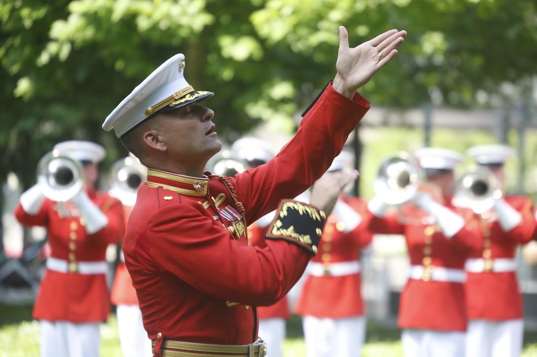 U.S. Marine Maj. Christopher E. Hall, commanding officer and director of The Commandant’s Own, conducts the Drum and Bugle Corps at the 9/11 Memorial during Fleet Week New York, May 29, 2016. U.S. Marines and sailors are in New York to interact with the public, demonstrate capabilities, and teach the people of New York about America’s sea service. (U.S. Marine Corps Photo by Lance Cpl. Jimmy J. Vertus Combat Camera/Released).