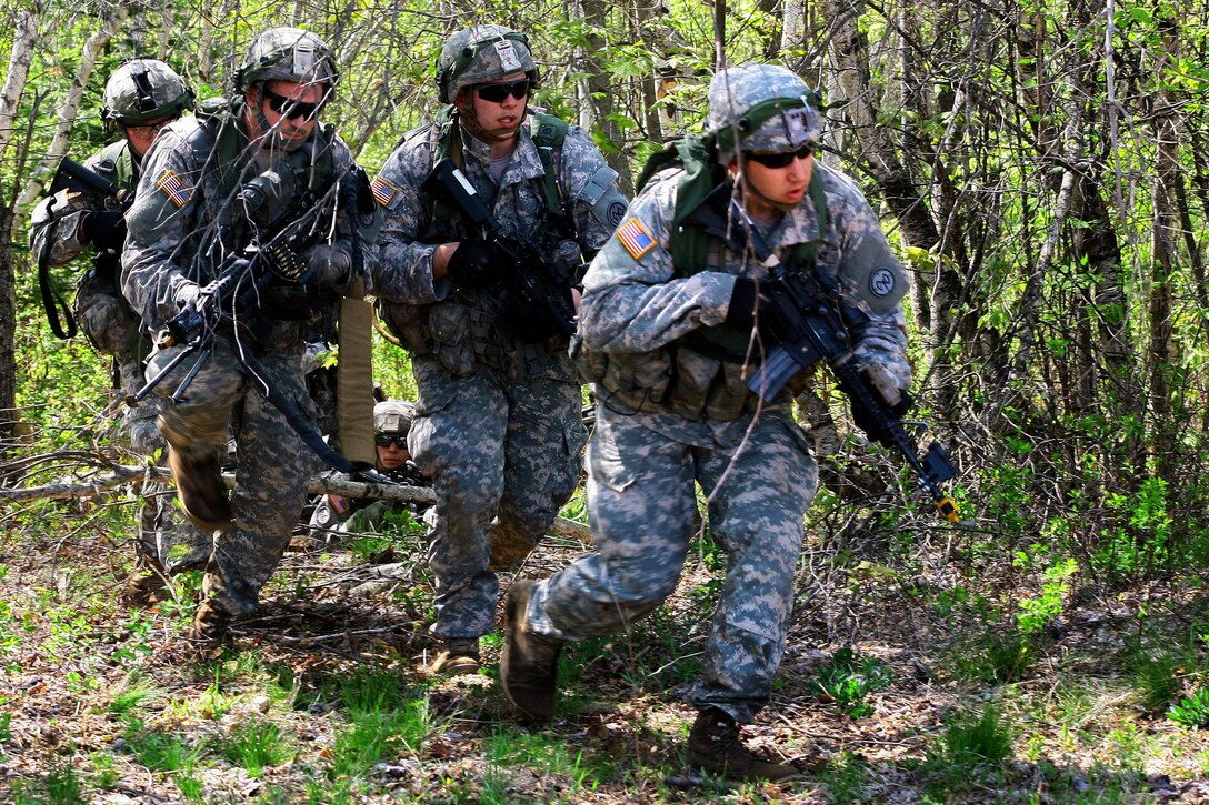 Soldiers maneuver through the woods during a field training exercise at Fort Drum, N.Y., May 20, 2016. Army National Guard photo by Sgt. Alexander Rector