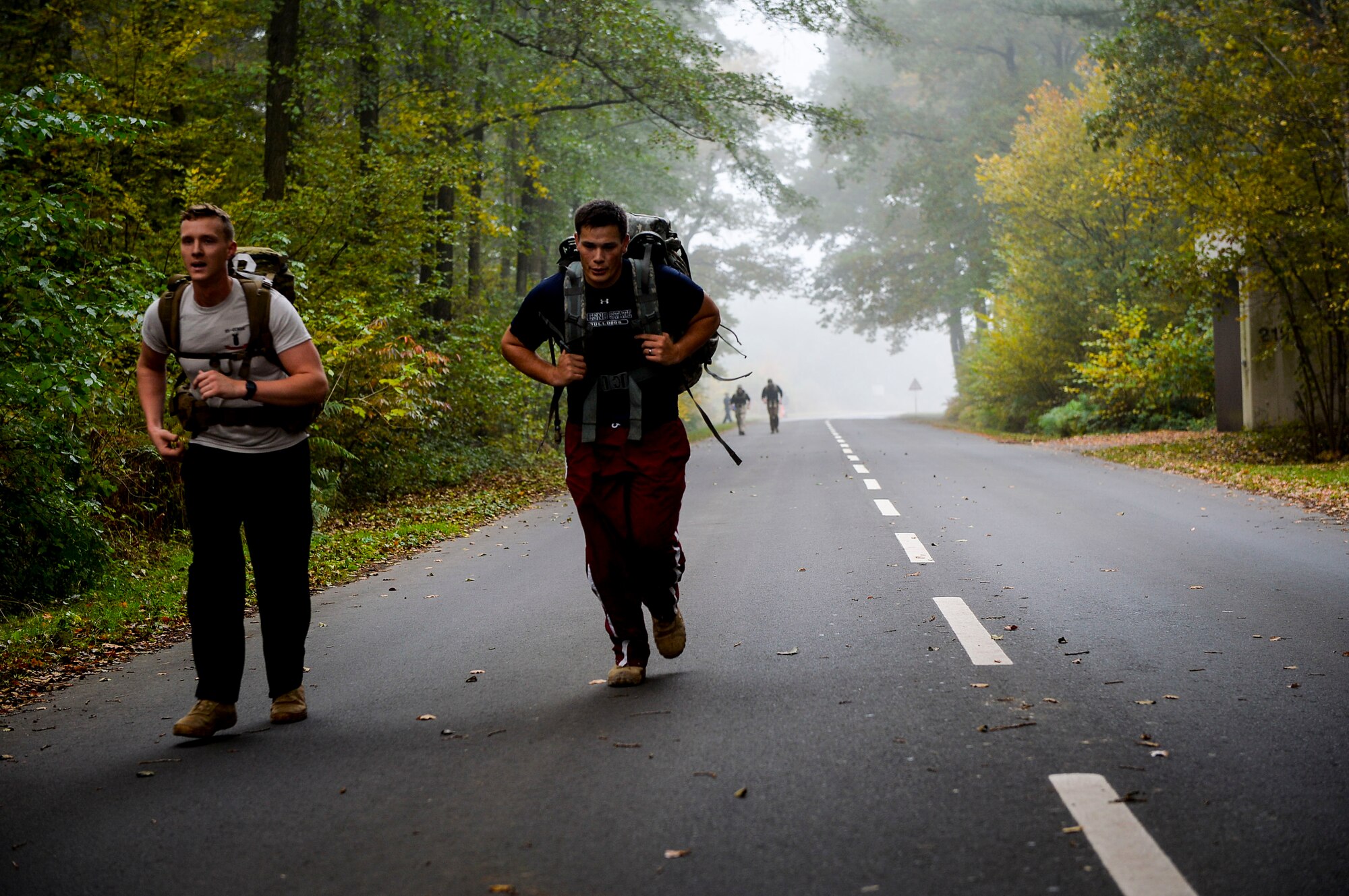 Participants in the 786th Civil Engineer Squadron’s explosive ordnance disposal ruck and run complete their final lap at Ramstein Air Base, Germany, Oct. 28, 2016. Although 786th CES’s EOD flight conducts ruck marches every month, the October ruck and run was a special Halloween-themed event designed to support the Combined Federal Campaign. (U.S. Air Force photo by Airman 1st Class Joshua Magbanua)