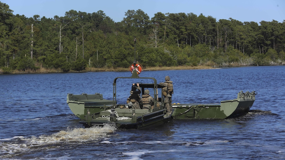 Marines with 1st Platoon, Bridge Company, 8th Engineer Support Battalion, transport a piece of an improvised ribbon raft as part of the Marine Corps Combat Readiness Evaluation at Camp Lejeune, N.C., Oct. 26, 2016. The IRR will be used to transport Marines with 3rd Battalion, 8th Marine Regiment across the body of water during another portion of the MCCRE. 