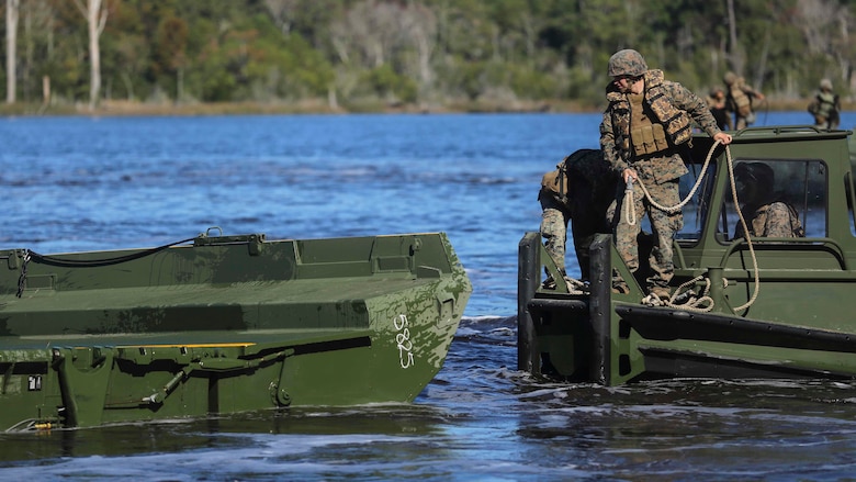 Marines with 1st Platoon, Bridge Company, 8th Engineer Support Battalion, attach a rope to a section of an improvised ribbon raft as part of the Marine Corps Combat Readiness Evaluation at Camp Lejeune, N.C., Oct. 26, 2016. The IRRs have two parts, an interior bay and a ramp bay which link together to make a bridge. 