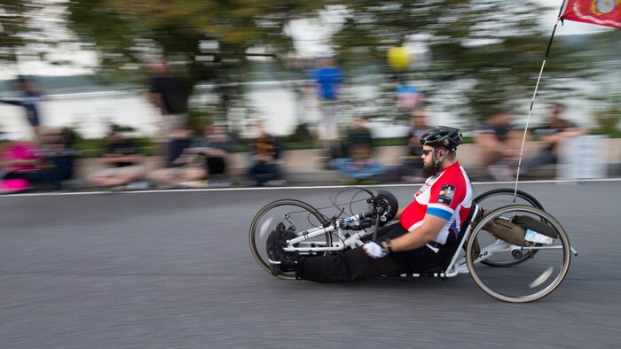 A hand cyclist peddles past the 9-mile marker as part of the 41st Marine Corps Marathon, Oct. 30, 2016. The MCM is a 26.2-mile course that runs through Washington, D.C. and Northern Virginia. The Marine Corps Marathon is also known as “The People’s Marathon.”