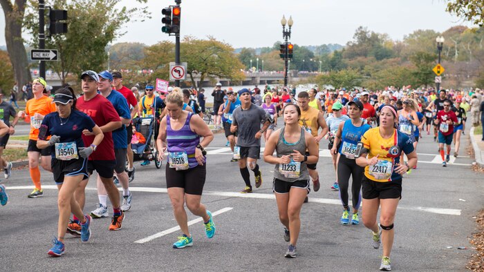 A group of runners past the 10-mile marker as part of the 41st Marine Corps Marathon, Oct. 30, 2016. The MCM is a 26.2-mile course that runs through Washington, D.C. and Northern Virginia. The Marine Corps Marathon is also known as “The People’s Marathon.”