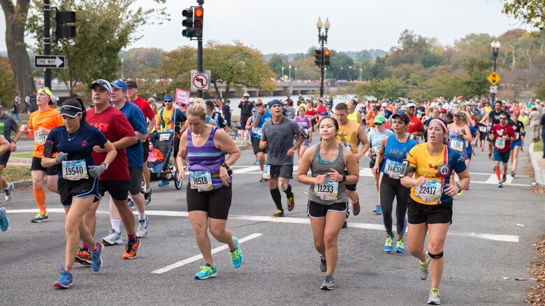 A group of runners past the 10-mile marker as part of the 41st Marine Corps Marathon, Oct. 30, 2016. The MCM is a 26.2-mile course that runs through Washington, D.C. and Northern Virginia. The Marine Corps Marathon is also known as “The People’s Marathon.”
