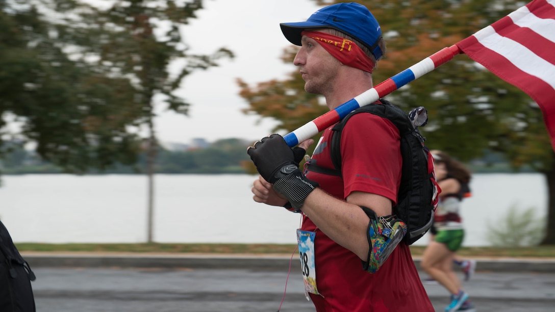 Runners past 9-mile marker as part of the 41st Marine Corps Marathon, Oct. 30, 2016. The MCM is a 26.2-mile course that runs through Washington, D.C. and Northern Virginia. The Marine Corps Marathon is also known as “The People’s Marathon.”