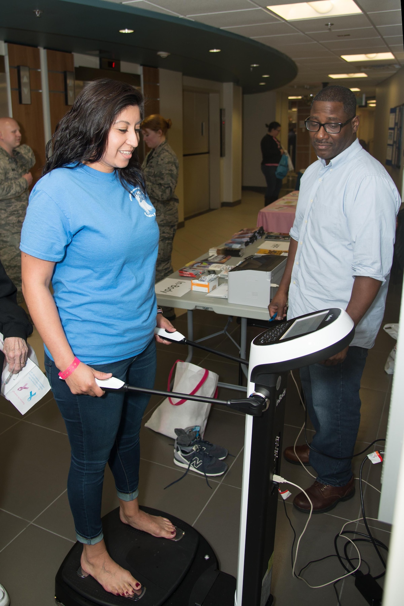 Dan Mumford, Dover Air Force Base Health and Wellness registered dietician, measures a guest’s body fat percentage during the Health Fair hosted by the 436th Medical Group Oct. 28, 2016, on Dover AFB, Del. Body fat screenings are available for free at the Health and Wellness center. (U.S. Air Force photo by Mauricio Campino)