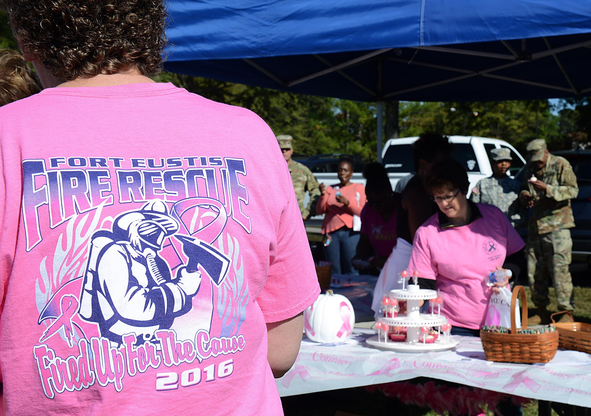 Members of the Joint Base Langley-Eustis, community socialize after the Breast Cancer Awareness Month walk at JBLE, Va., Oct. 28, 2016. According to the Center for Disease Control, breast cancer is the most common cancer found in women. (U.S. Air Force photo by Staff Sgt. Teresa J. Cleveland)