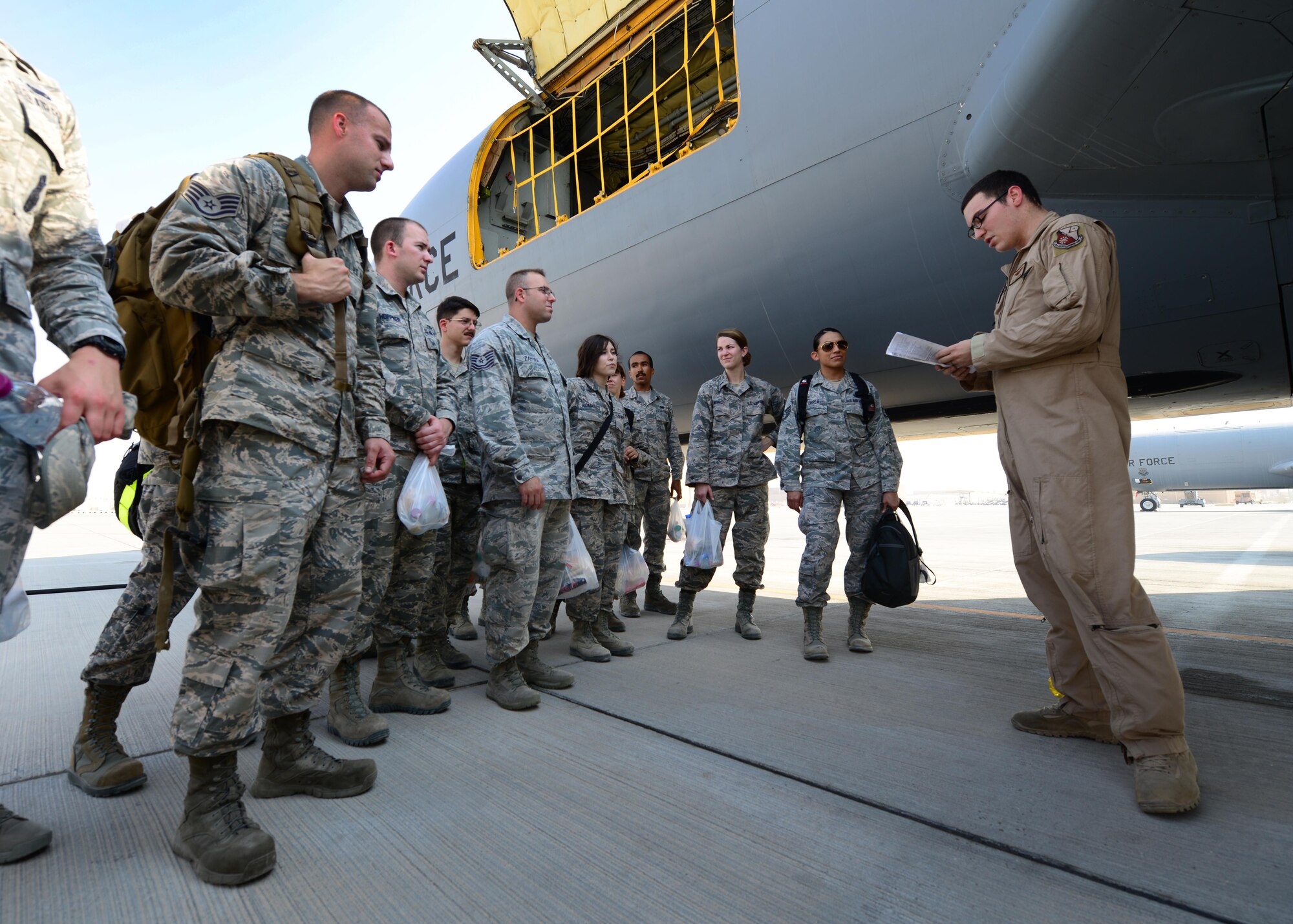 An Airman from the 340th Expeditionary Refueling Squadron gives a briefing to members of the 379th Air Expeditionary Wing at Al Udeid Air Base, Qatar Oct. 27, 2016. The members were part of an incentive flight onboard a KC-135 Stratotanker during which they witnessed the refueling of F-16 Fighting Falcons. (U.S. Air Force photo by Senior Airman Miles Wilson)
