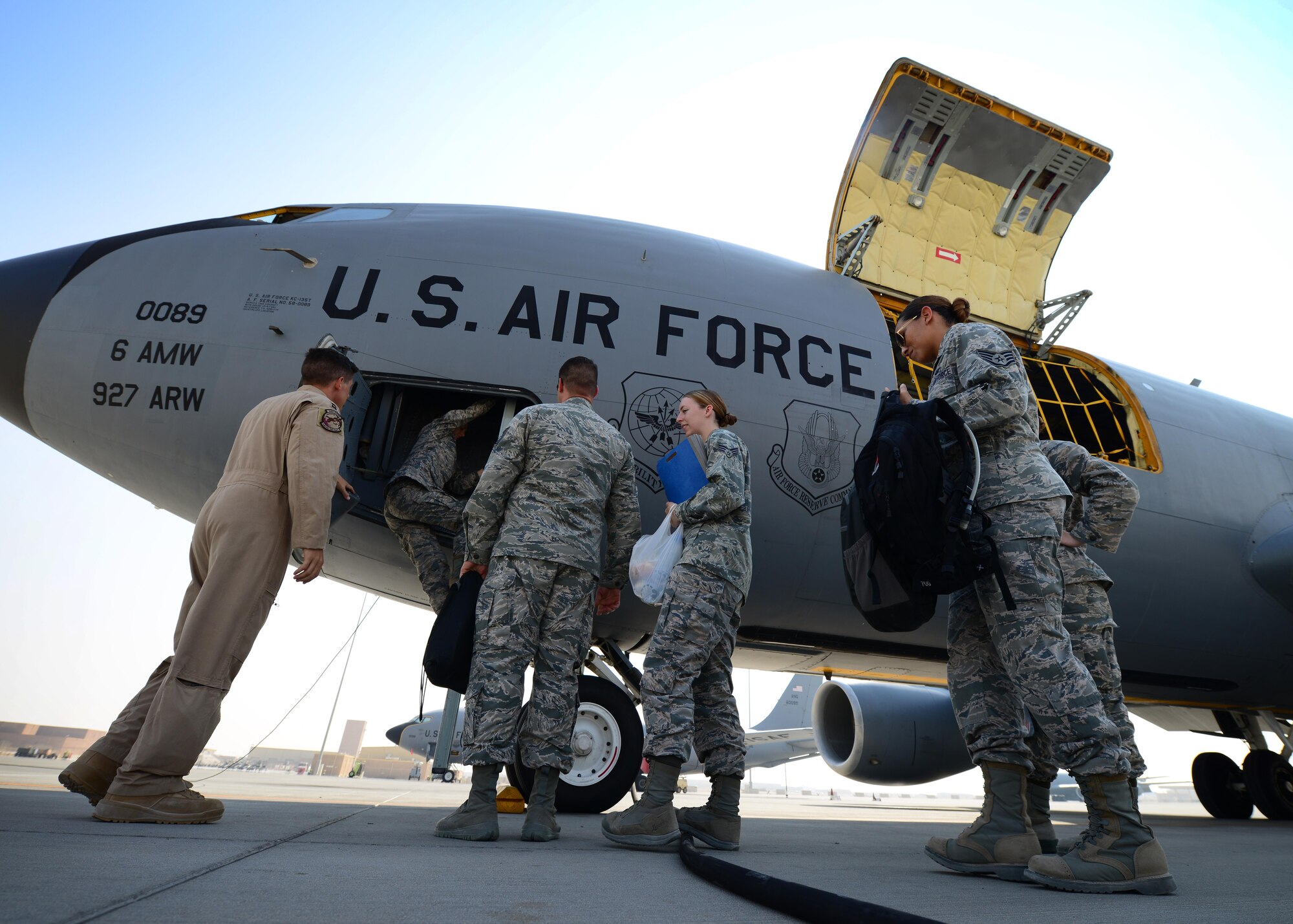 Airmen with the 379th Air Expeditionary Wing board a KC-135 Stratotanker at Al Udeid Air Base, Qatar Oct. 27, 2016. The members were from units across the base and took part in an incentive flight hosted by the 340th Expeditionary Air Refueling Squadron. (U.S. Air Force photo by Senior Airman Miles Wilson)