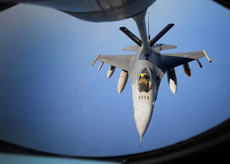 An F-16 Fighting Falcon receives fuel from a KC-135 Stratotanker Oct. 27, 2016. The 340th Expeditionary Air Refueling Squadron hosted Airmen from the 379th Air Expeditionary Wing as part of an incentive flight and gave the members an opportunity to see the process of air refueling. (U.S. Air Force photo by Senior Airman Miles Wilson)