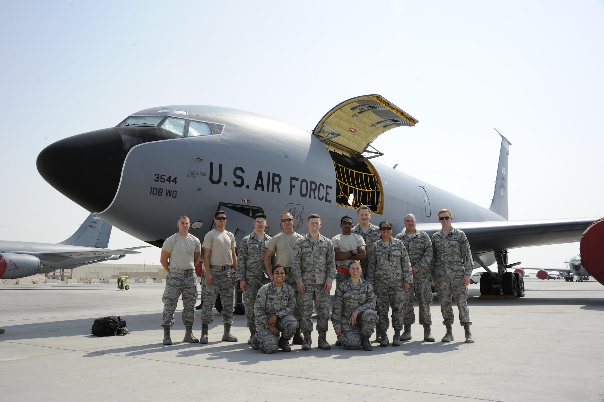 379th Air Expeditionary Wing Airmen pose for a group photo prior to taking an incentive flight at Al Udeid Air Base Oct. 27, 2016. The Airmen learned about the KC-135 Stratotanker during a tour organized in appreciation of the 379th Air Expeditionary Wing Airman’s dedication to the U.S. Air Force mission. (U.S. Air Force Photo by Senior Airman Cynthia A. Innocenti)